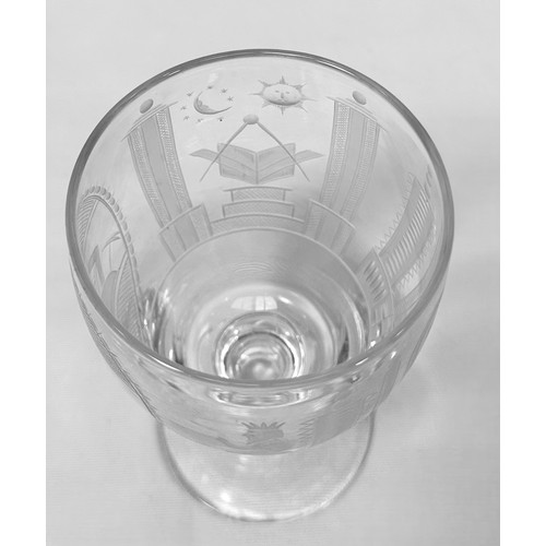 25 - A 19th century charging glass, decorated with engraved, cut and etched Masonic devices, raised on kn... 