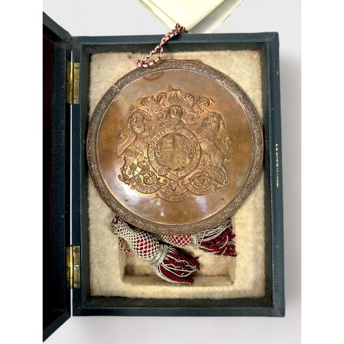 480 - An Edward VII red wax seal, with cord running through centre, housed in circular copper skippet by G... 