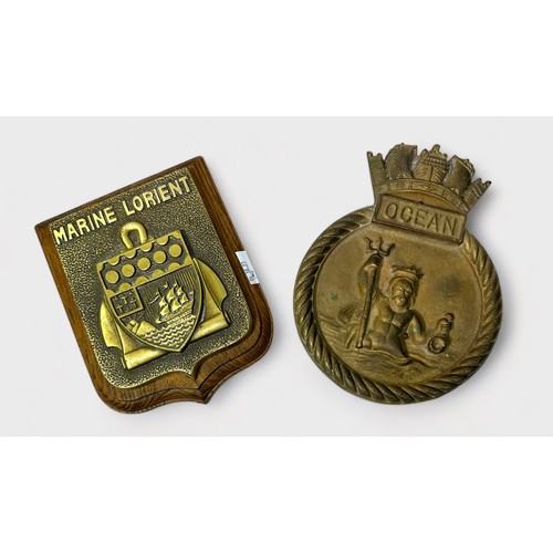 595 - Two Ships Crests / Tampions, a heavy duty cast brass ships badge for HMS Ocean, and another ‘Marine ... 