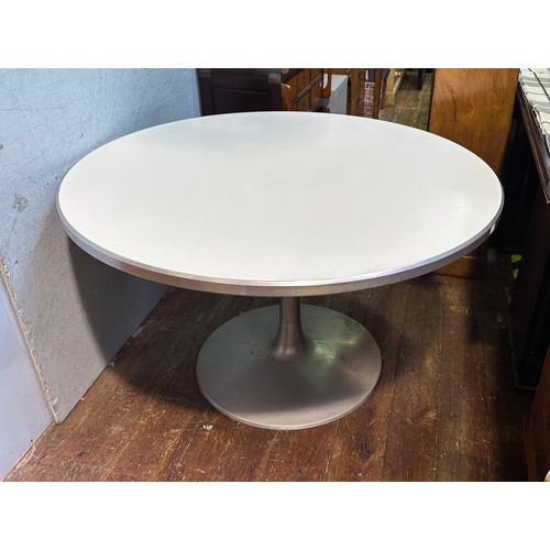 291 - An Eero Saarinen 'Tulip' style circular table, with white top, raised on brushed aluminium base, top... 