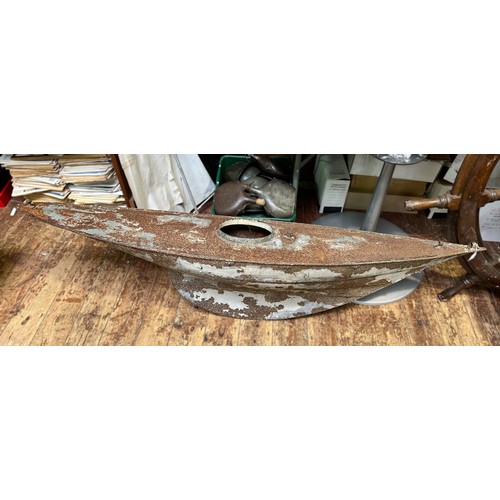 589 - An early to mid 20th century large metal pond yacht hull, with circular open hatch and wighted keel,... 