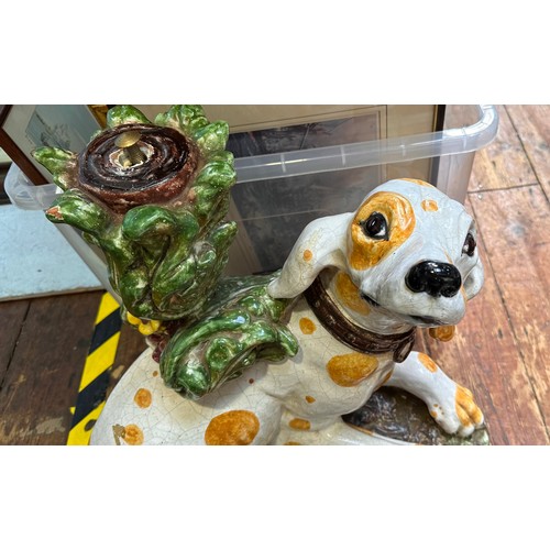 19 - A majolica pottery table base modelled as a Dalmatian dog with yellow spots, raised on naturalistic ... 