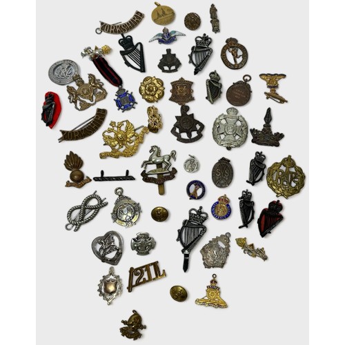 584 - A small quantity of military badges, buttons and insignia, together with 'RAF' and 'The Buffs' silve... 