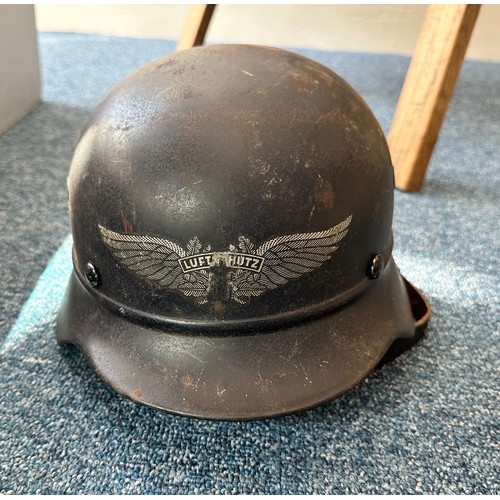 499 - A WW2 Third Reich Luftschultz Helmet (Fire brigade), size Q62, with brown leather liner