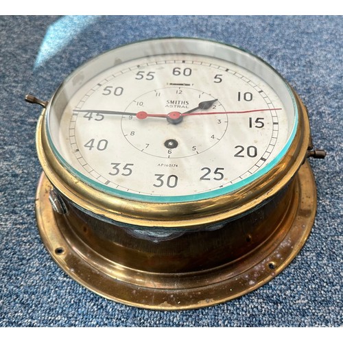 498 - A Smiths Astral Brass Ship's Bulkhead Clock, with inner hour dial and outer seconds dial and red sec... 