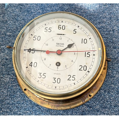 498 - A Smiths Astral Brass Ship's Bulkhead Clock, with inner hour dial and outer seconds dial and red sec... 