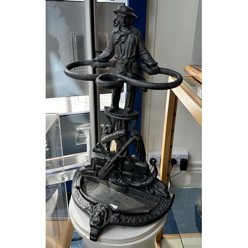 496 - A Victorian cast iron umbrella/stick stand, cast with figure of a sailor holding rigging upon a caps... 