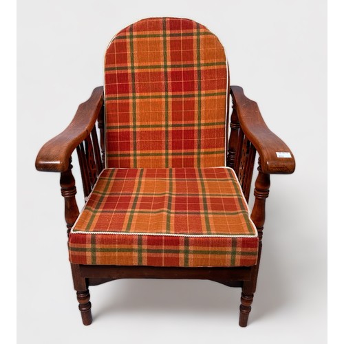 502 - A 20th Century stained beech and ash metamorphic low-seated reclining chair, Windsor 'style' wheel a... 