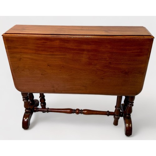 509 - A late 19th century figured walnut drop-leaf Sutherland table, hinged swivel-top on twin-turned gate... 