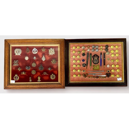 555 - Four glazed wooden wall-hanging display cases containing various military and naval cap badges and b... 