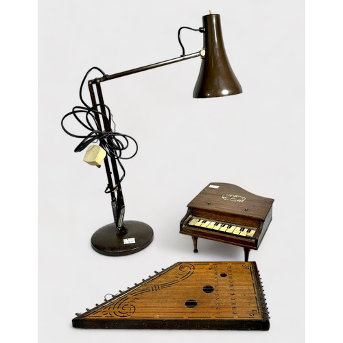 554 - A miniature wooden grand piano and wooden stringed zither, together with a brown anglepoise 'type' t... 