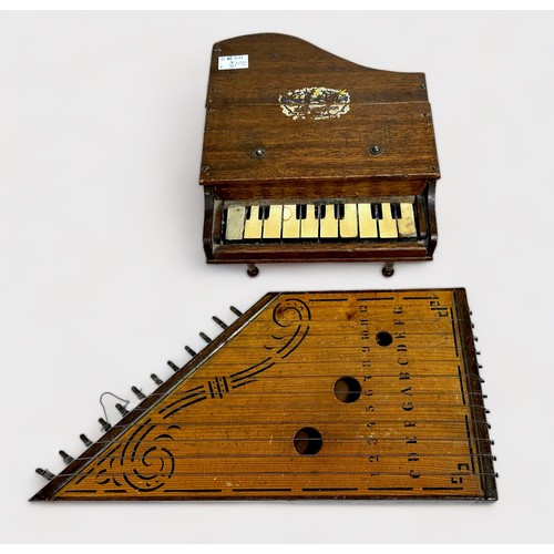 554 - A miniature wooden grand piano and wooden stringed zither, together with a brown anglepoise 'type' t... 