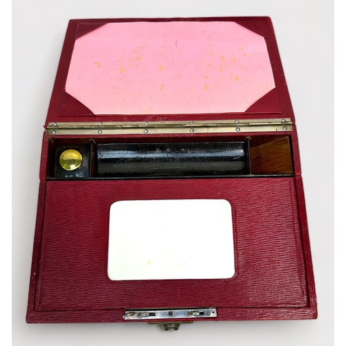 553 - A mid 20th century red leather folding writing slope and staionary box, together with a Chinese lacq... 