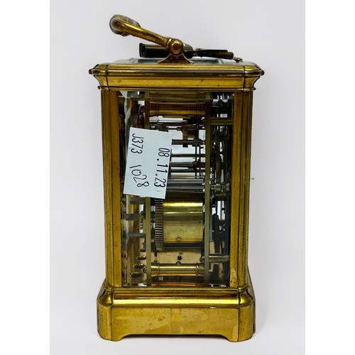 389 - A 19th century brass repeating carriage alarm clock, 8-day movement striking a bell, finely foliate-... 