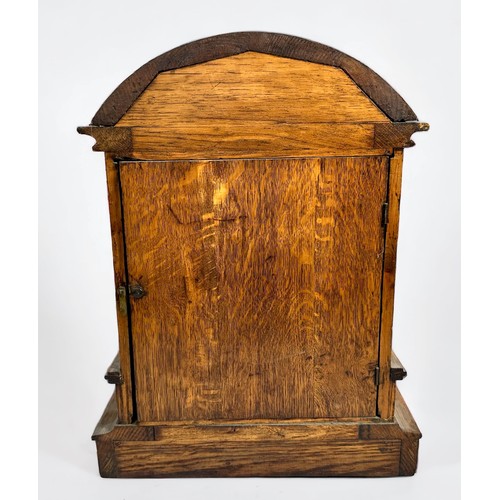 386 - An Edwardian oak-cased mantel clock, with eight-day spring driven movement striking a gong, brass di... 