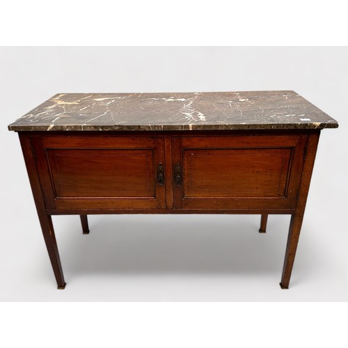 513 - An Edwardian stained walnut wash stand with marble top above a pair of cupboard doors, raisen on squ... 