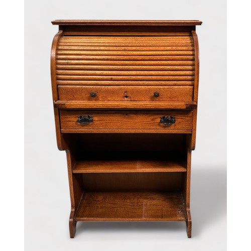 511 - An early 20th century oak roll-top bureau of narrow proportions, with retracting scribe, roll-top en... 