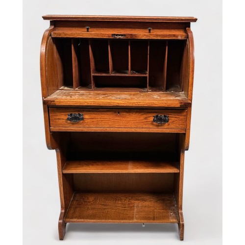 511 - An early 20th century oak roll-top bureau of narrow proportions, with retracting scribe, roll-top en... 