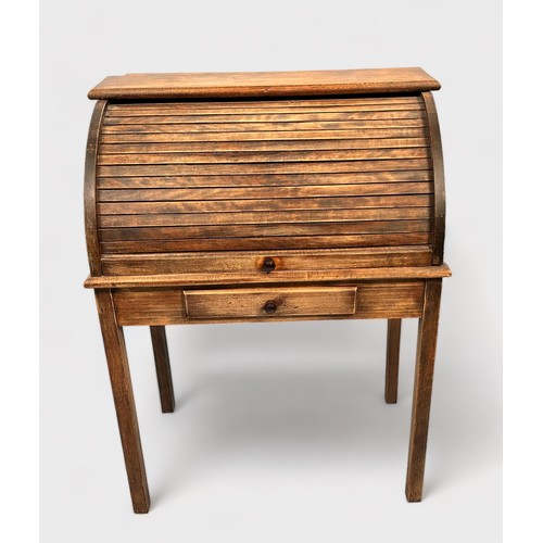 516 - An early 20th century stained oak child's roll-top desk, with enclosed pigeonholes, short frieze dra... 