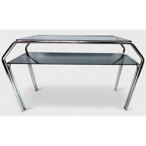 521 - A 20th century two-tier side table of chromium-plated tubular steel frame construction with smoked g... 