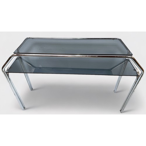 521 - A 20th century two-tier side table of chromium-plated tubular steel frame construction with smoked g... 