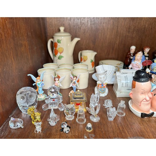 15 - A quantity of mixed ceramics, comprising, Royal Doulton, Beswick, Swarovski, etc., to include, a Bes... 