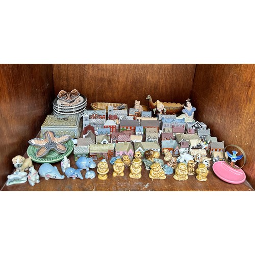 14 - A large collection of Wade ceramics, comprising, more than forty Wade Whimsey-on-Why cottages, inclu... 