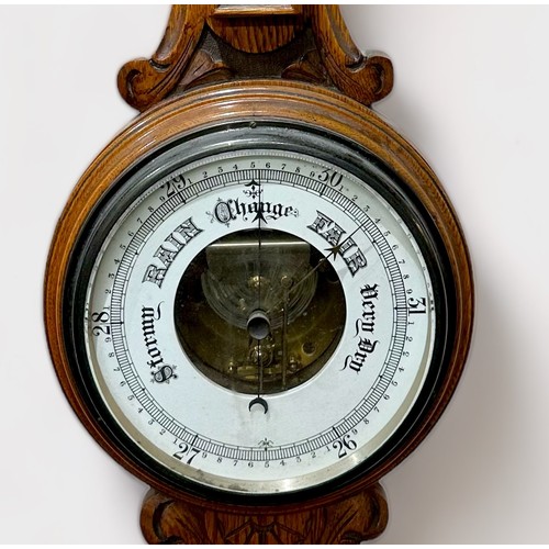 391 - A Victorian aneroid barometer with exposed movement and bellows, and mercury thermometer with dual s... 