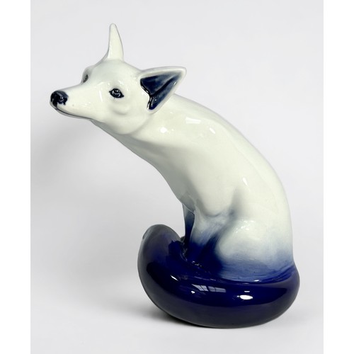 23 - A Royal Doulton large blue 'Flambe' model of a seated fox, impressed number 102, 23cm high