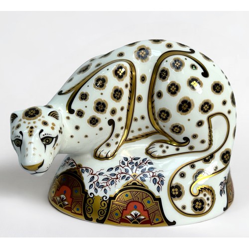 31 - A Royal Crown Derby porcelain paperweight, 'Snow Leopard,' 2006, gold stopper, unboxed, 13.5cm high