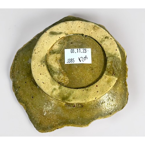 36 - A late 17th Century English 'delft' pottery royal commemorative charger fragment, showing the centra... 