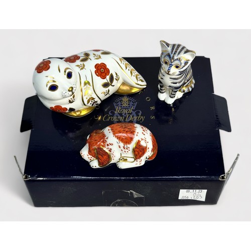 35 - Three Royal Crown Derby porcelain paperweights, comprising 'Puppy' Exclusive Collectors Guild, boxed... 