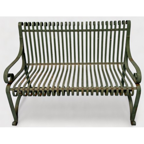 526 - A green-painted wrought-iron garden bench 126cm wide