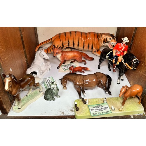 22 - Various Beswick Pottery figures including 'Canadian Mountie,' (hat brim glued),  Mare and Faol (A/F)... 