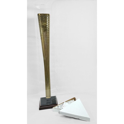 610 - A 2012 London Olympic Games Bearer's Torch, of tapering, triangular form, gold coloured, bearing the... 