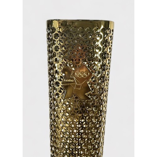 610 - A 2012 London Olympic Games Bearer's Torch, of tapering, triangular form, gold coloured, bearing the... 