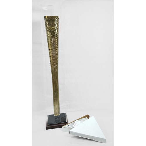 609 - A 2012 London Olympic Games Bearer's Torch, of tapering, triangular form, gold coloured, bearing the... 