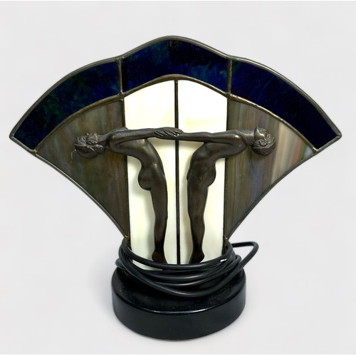 399 - An Art Deco style table lamp, cast with a pair of nude dancing girls in profile before a fan shaped ... 