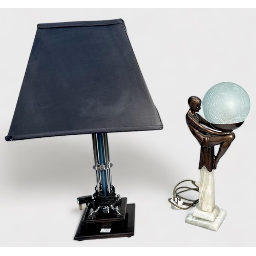 401 - An Art Deco figural table lamp, modelled with a 'flapper girl' supporting a spherical 'crazed glass'... 