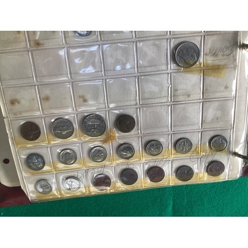 307 - An album containing approximately 430 coins in 11 sheets of mainly 20th century foreign coins, by co... 