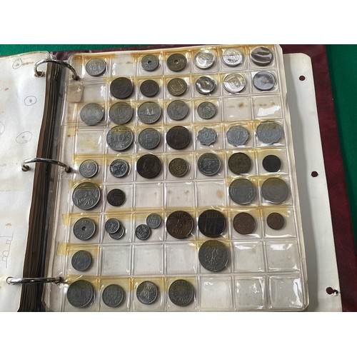 307 - An album containing approximately 430 coins in 11 sheets of mainly 20th century foreign coins, by co... 