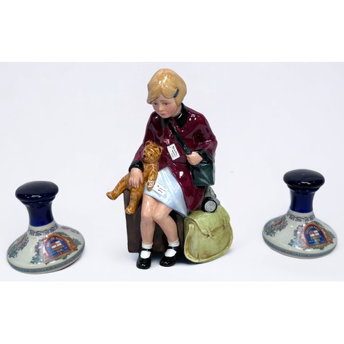 41 - A Royal Doulton figure, 'The Girl Evacuee,' HN 3203, together with two small Wade pottery decanters ... 