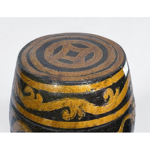 73 - A Chinese pottery barrel seat, incised and painted with a dragon and scrollwork wity beige and brown... 