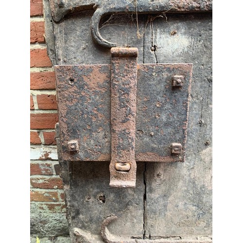 515 - An extremely heavy Medieval Oak lancet-shape castle door, of plank and ledge construction with origi... 