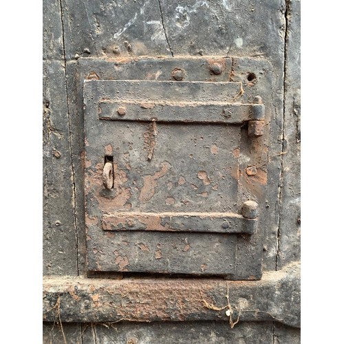 515 - An extremely heavy Medieval Oak lancet-shape castle door, of plank and ledge construction with origi... 