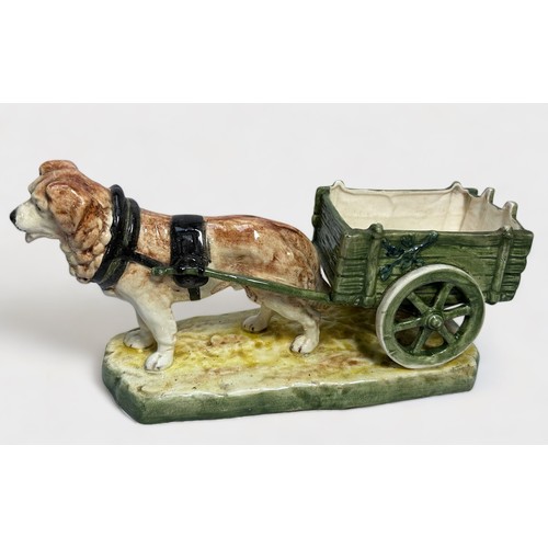 42 - A Royal Royal Dux pottery figure of a dog pulling a cart, 34cm long, impressed number 12796, printed... 