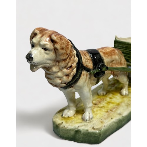 42 - A Royal Royal Dux pottery figure of a dog pulling a cart, 34cm long, impressed number 12796, printed... 