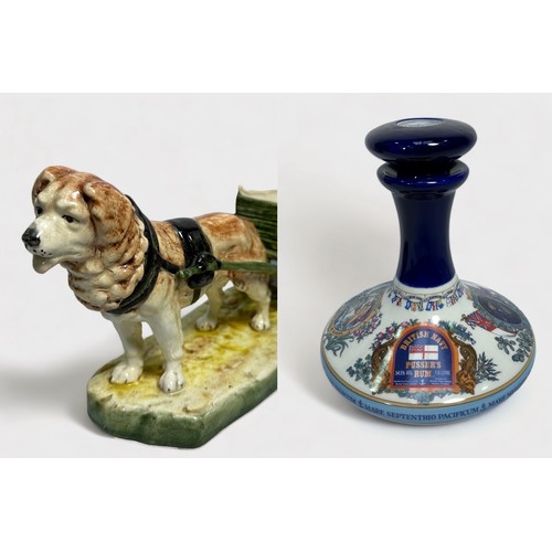 42 - A Royal Royal Dux pottery figure of a dog pulling a cart, 34cm long, impressed number 12796, printed... 