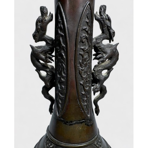 75 - A Chinese cast and patinated bronze vase, late Qing Dynasty, of globular form with elongated neck mo... 