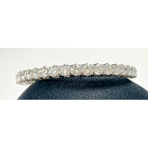 295 - An 18ct white gold diamond bangle, claw set with 50 x round brilliant cut diamonds, estimated total ... 